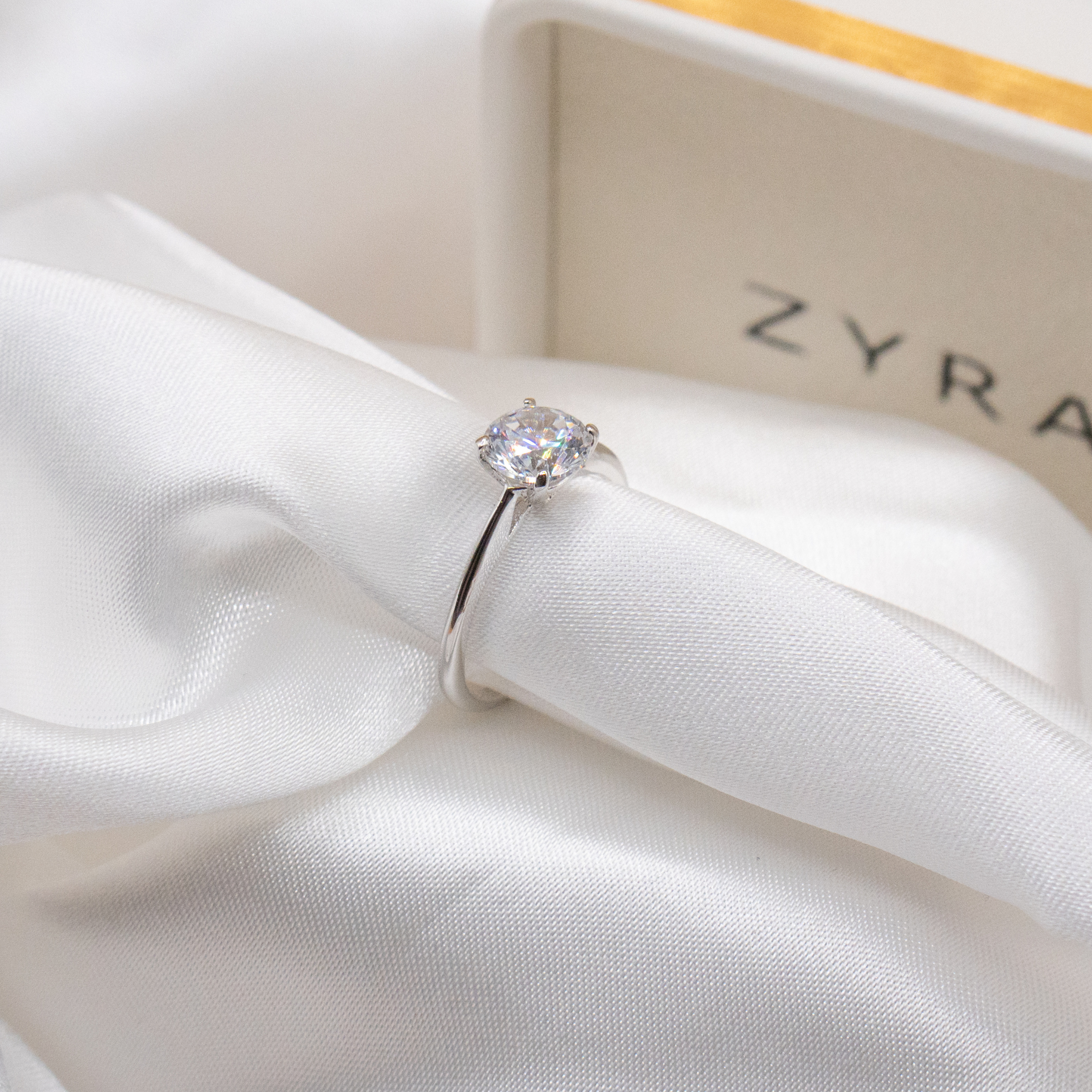 ZYRA® Juna Engagement Ring in S925 Sterling Silver with CZ Stone (Buy 1 Get 1 Free 0.1-carat Moissanite Kairi Earrings)